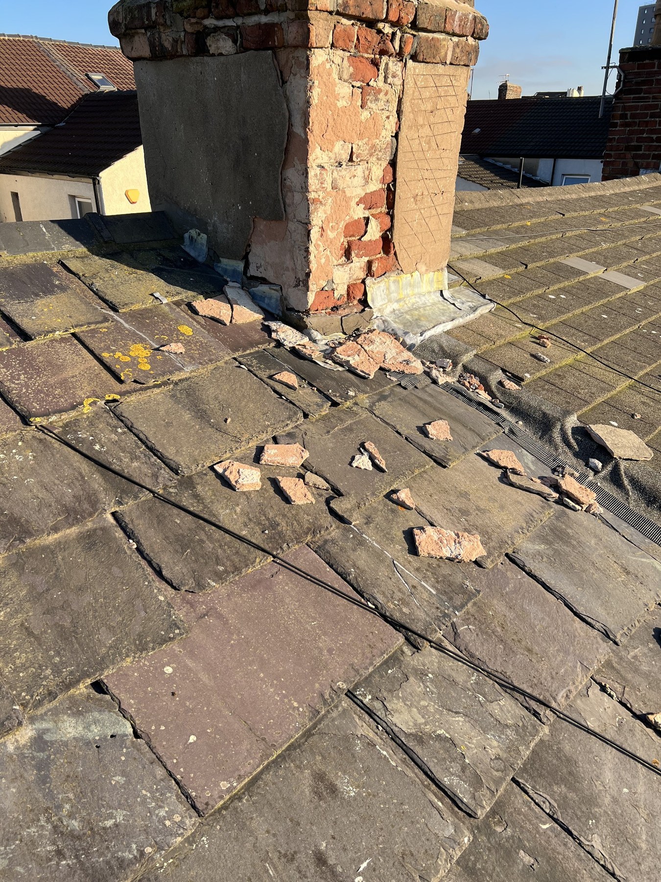 Damaged chimney stack before render repair by Wavertree Roofing