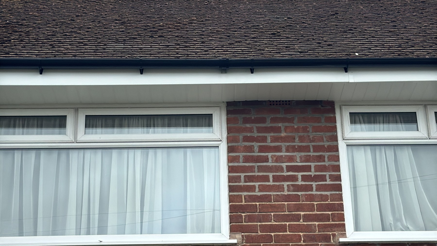 New fascia soffit and black guttering after work by Wavertree Roofing