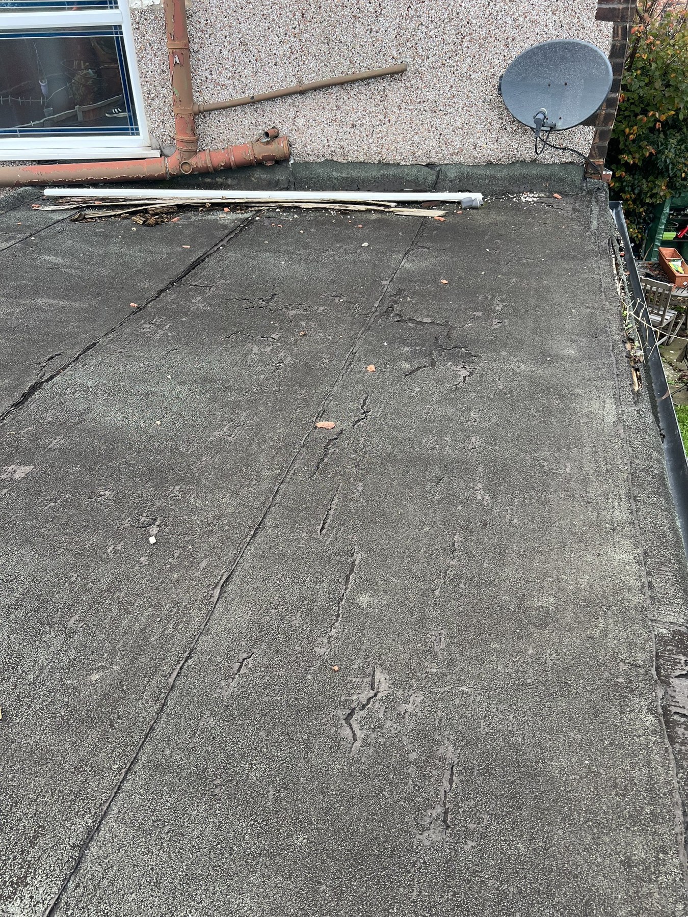 Worn flat roof before replacement by Wavertree Roofing