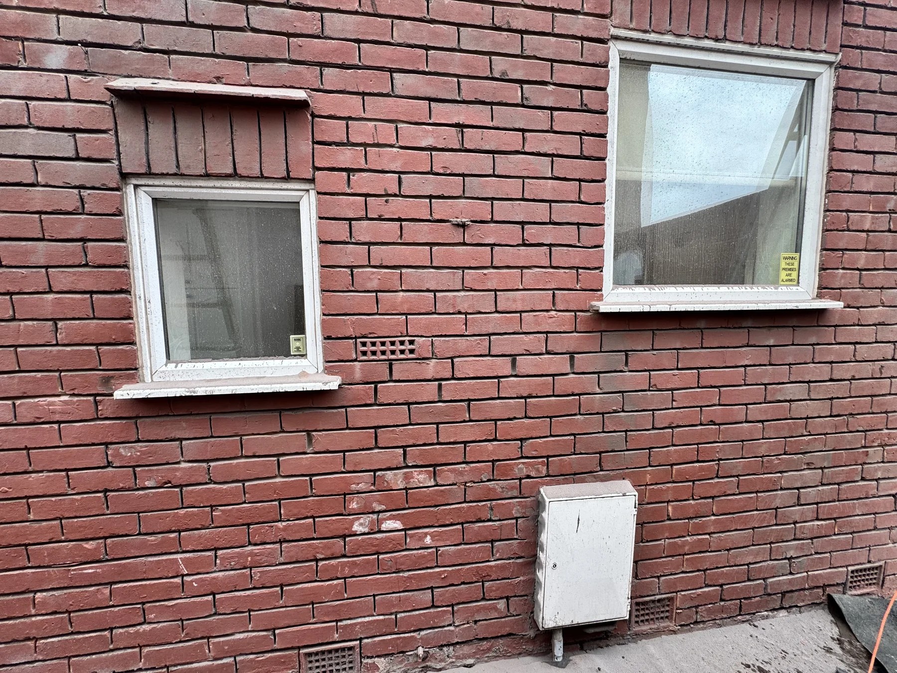 Close view of brickwork before pointing repair by Wavertree Roofing